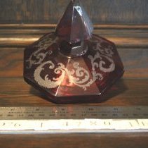 Top to red glass goblet