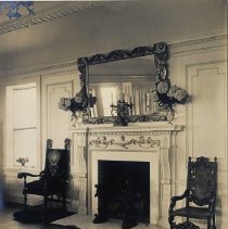 Living room towards fireplace, flowers on mantle