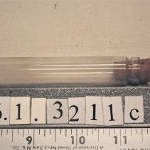 1976.1.3211c  One of four vials in the flask