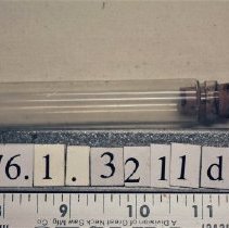 1976.1.3211d  One of four vials in the flask