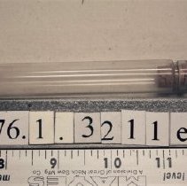 1976.1.3211e One of four vials in the flask