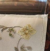 Embroidery detail, reproduction