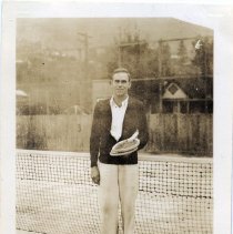 Man on tennis court