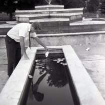 Man cleaning fountain