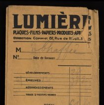 Envelope, held A2024.10.36-40, negatives, and postcard