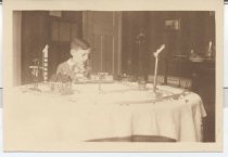 Train Set on Dining Table as Boy Plays