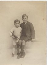 Two Brothers Posing with Toy Locomotive