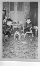 Two boys with clockwork train set