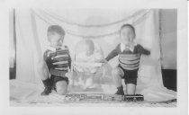 Two Boys and Baby with Toy Train