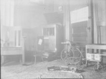 Train set on floor with other toys in background.