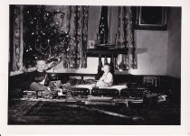 Two Boys Play with Standard Gauge Trains at Christmas