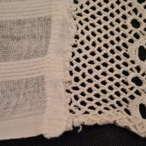 2014.28.02 Tatting Attached To Back Of Apron