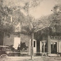 Simkins house in Newburgh with M.W. Simkins and wife in front