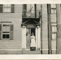 Unidentified Woman Standing in Front of the Hart-Treat House