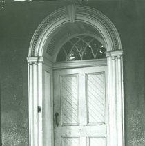 Dog sleeping in doorway