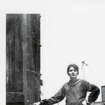 Lady by railroad car