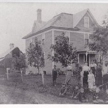 Unidentified house, family, and barn