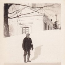 Charles Vibert standing in a snowy street