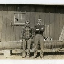 Victor and Barney Daley with a canoe