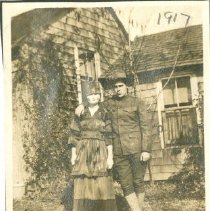 Albert Moluton with a woman in a mask