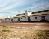 white warehouse on  E. 4th