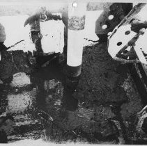 Northeast Primary Tank. Heavy deposits of grit and debris in the sump pit of primary tank no. 3...Pictures A, B, and C are different views of tank No.