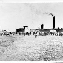 Football Game With Mill In Background100