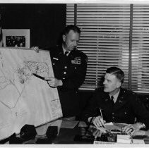Col. Walter Kraus Studies a Map of the Presidio of Monterey, n.d.