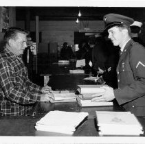 Pvt Carlson, 10,000th Russian Program graduate, with his textbooks, 1967
