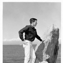 Carlson posing by the ocean, 10,000th Russian Graduate, 6 April 1967