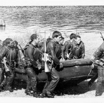 Fort Ord training - soldiers carrying a raft