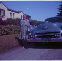 Mrs. Joseph W. Stilwell with her car with "JWS-CBI" license in Carmel.