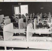 DLIWC: Students listening with headphones in the language lab