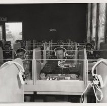 DLIWC: Students listening with headphones in the language lab