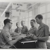 DLIWC: Students checking out textbooks and audio equipment