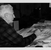 Bruce Ariss, DLIWC reproduction department, works on a drawing, 1971.