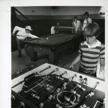 Fort Ord -family life & child care: child playing foosball