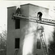 Fort Ord -firefighters: fighting fire on ladder