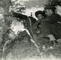 Regiment crew firing machine gun