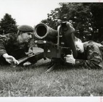 Fort Ord -field maneuvers: soldiers looking through a scope