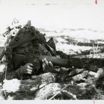 Fort Ord -field maneuvers: soldier aiming a gun
