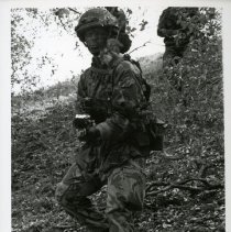 Fort Ord -field maneuvers: soldier aiming a gun