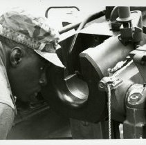 Fort Ord -field maneuvers: soldier looking through weapon sight