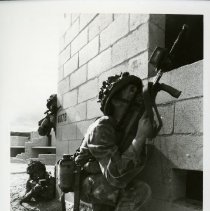 Fort Ord -field maneuvers: soldiers entering building