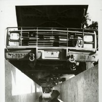 Fort Ord -field maneuvers: inspecting a vehicle's motor