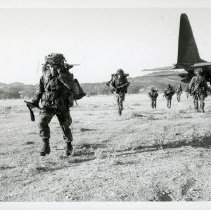 Fort Ord Soldiers Deploy from a Military Transport for a Field Exercise, ca. 1980s.