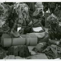 Fort Ord -field maneuvers: soldiers packing gear into bags