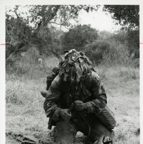 Fort Ord -field maneuvers: Soldier wiring a radio
