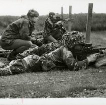 Fort Ord -field maneuvers: soldiers firing machine guns
