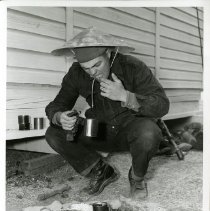 RVN training: soldier tasting liquid from a cup